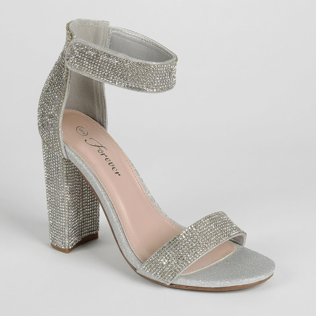 A single silver glitter block heel sandal with crystal-embellished straps and ankle strap, shown on a plain white background. The insole displays the brand name 'Forever'.